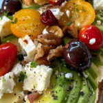 Avocado Toast with Feta, Cherry Tomatoes, Cranberries, and Walnuts